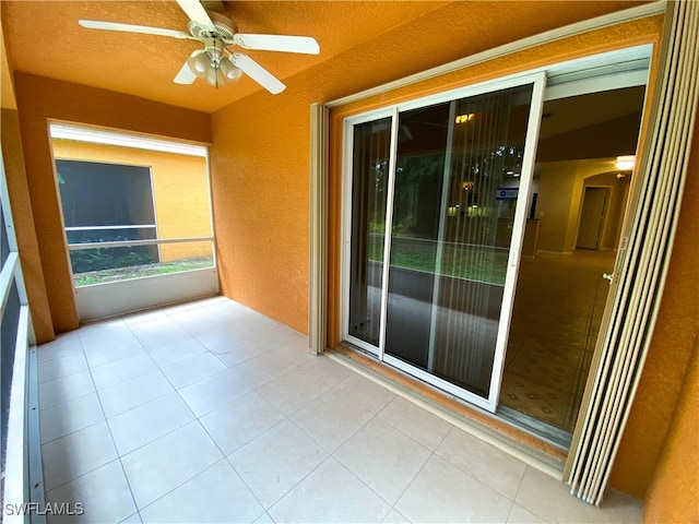 interior space featuring ceiling fan