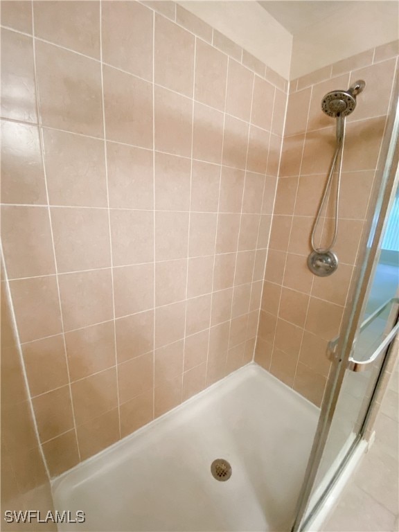 bathroom with a tile shower