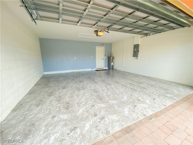 garage with a garage door opener, electric water heater, and electric panel