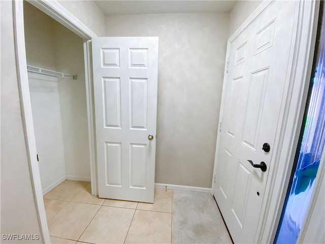 interior space with light tile patterned floors