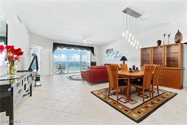 dining room featuring ceiling fan and light tile patterned floors