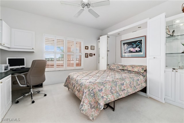 bedroom featuring ceiling fan and light colored carpet