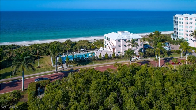 bird's eye view featuring a water view and a beach view