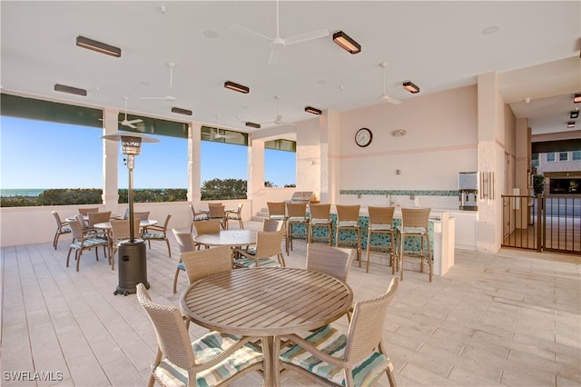 dining space featuring ceiling fan