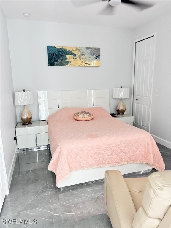 bedroom featuring ceiling fan and a closet