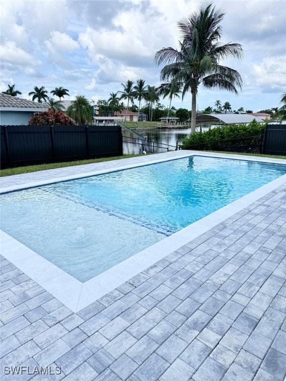 view of pool featuring a water view