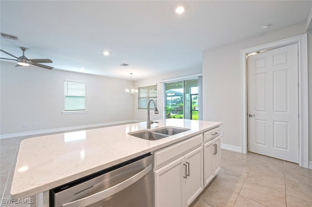 kitchen featuring light stone counters, stainless steel dishwasher, a kitchen island with sink, sink, and white cabinetry