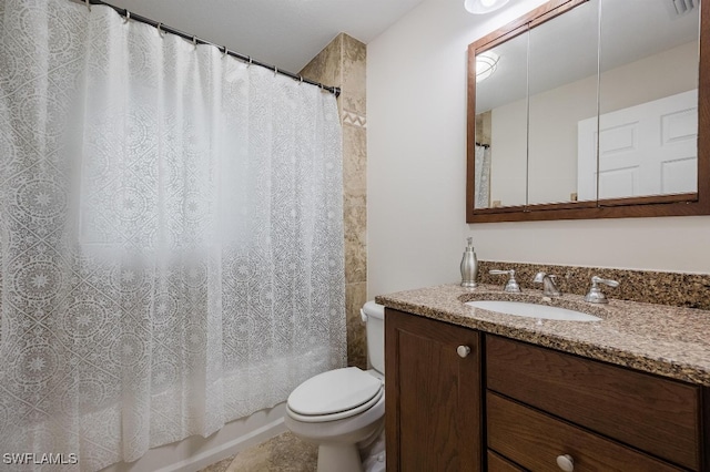 full bathroom with shower / tub combo, tile patterned flooring, vanity, and toilet