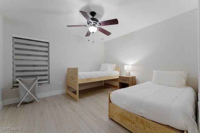 bedroom featuring ceiling fan and hardwood / wood-style flooring