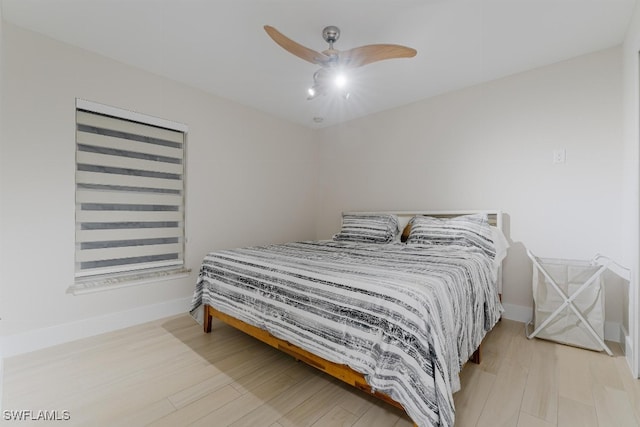 bedroom with wood-type flooring and ceiling fan