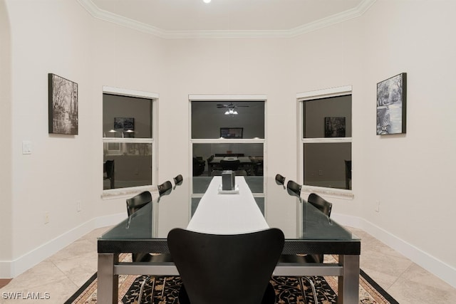 tiled dining area with ornamental molding and ceiling fan