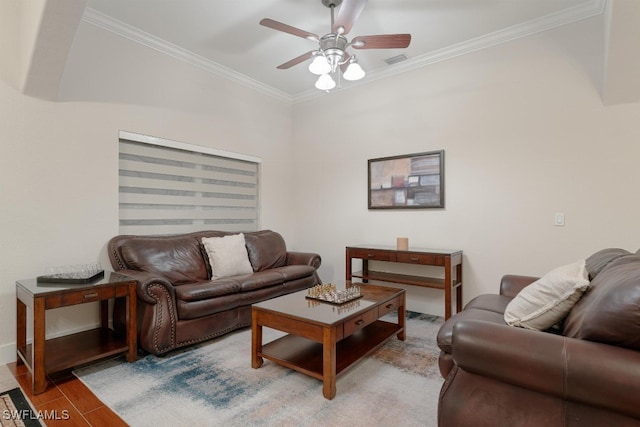 living room with ceiling fan, hardwood / wood-style flooring, and crown molding