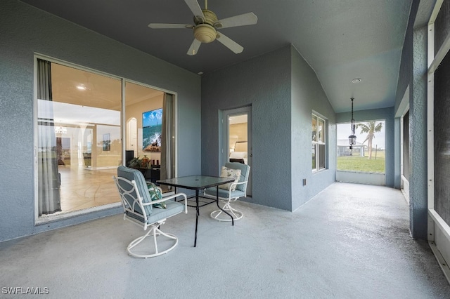 exterior space featuring vaulted ceiling and ceiling fan