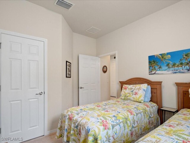 bedroom featuring carpet floors and visible vents