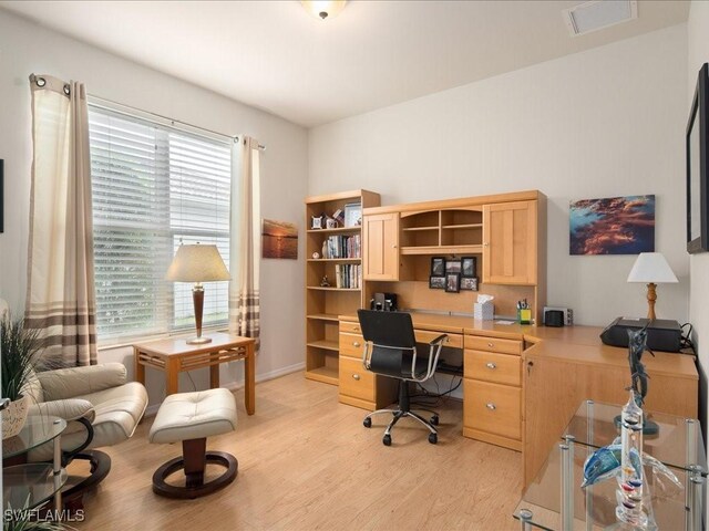 office space featuring light wood-style floors and visible vents