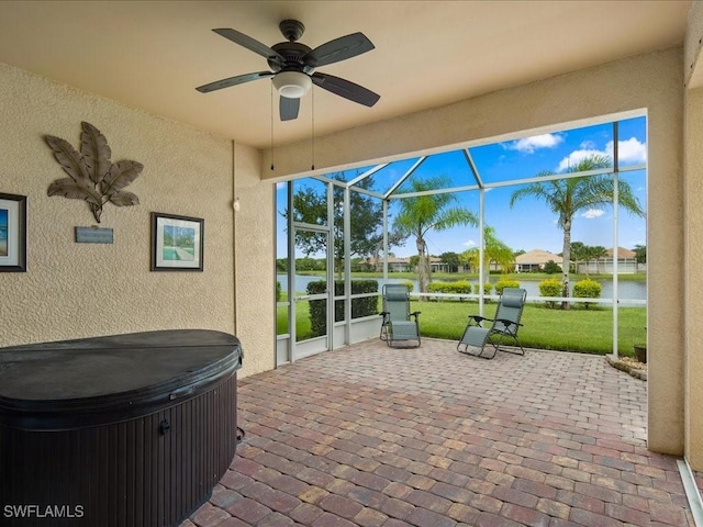 sunroom featuring ceiling fan