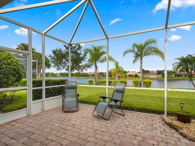 unfurnished sunroom with a water view