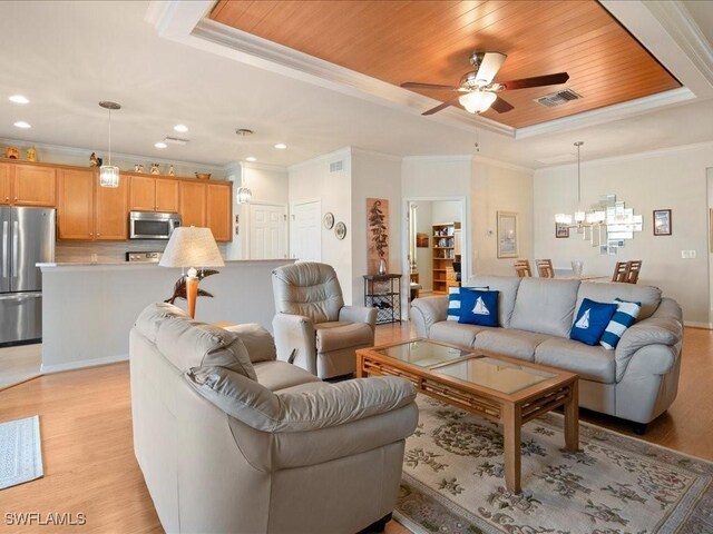 living room featuring a tray ceiling, light wood finished floors, visible vents, wooden ceiling, and ceiling fan with notable chandelier