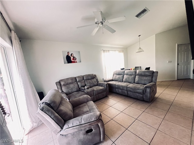 tiled living room featuring ceiling fan