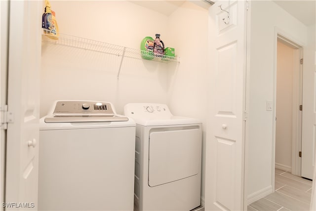 washroom with washer and clothes dryer