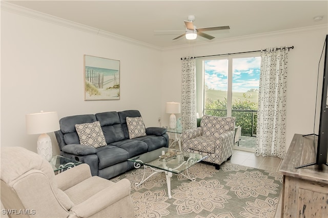 living room featuring ceiling fan, light tile patterned flooring, and ornamental molding