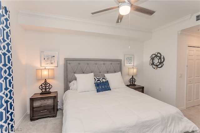 bedroom featuring light carpet, crown molding, and ceiling fan