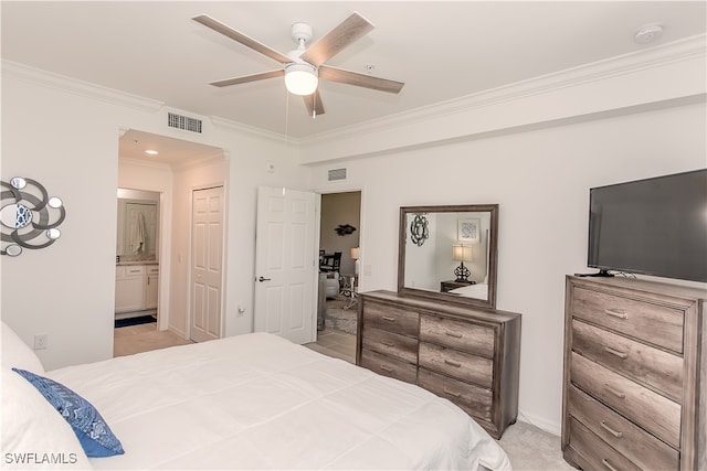 bedroom featuring connected bathroom, a closet, crown molding, ceiling fan, and light carpet