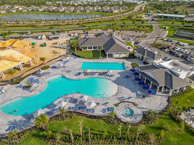 birds eye view of property with a water view