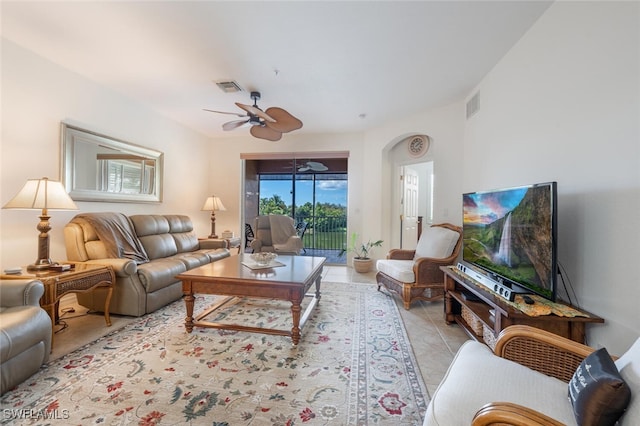 living room featuring ceiling fan and light tile patterned floors