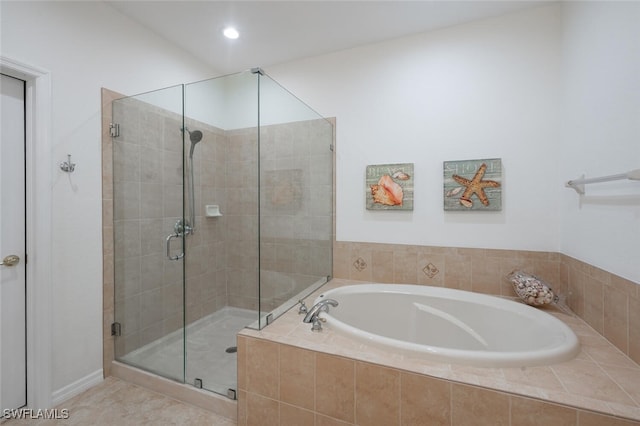 bathroom featuring plus walk in shower and tile patterned flooring