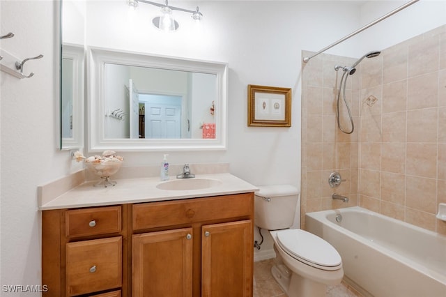 full bathroom featuring tiled shower / bath combo, tile patterned flooring, vanity, and toilet