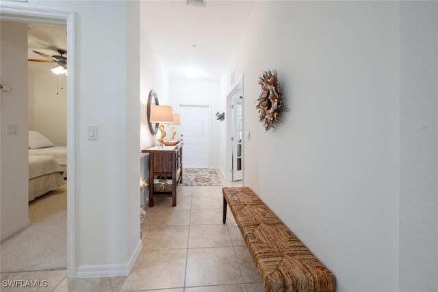 hallway featuring light tile patterned flooring