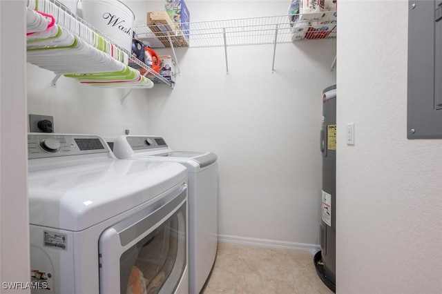 laundry area with light tile patterned floors, electric water heater, and washer and dryer