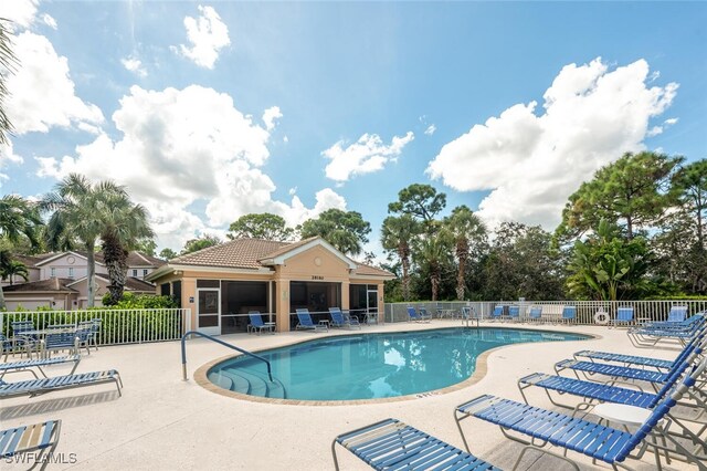 view of swimming pool featuring a patio