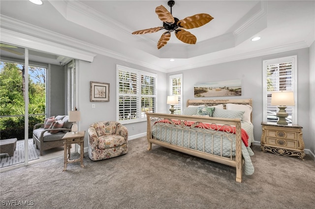 carpeted bedroom featuring access to outside, a raised ceiling, crown molding, and ceiling fan