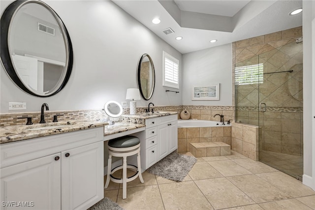 bathroom featuring shower with separate bathtub, tile patterned flooring, and vanity