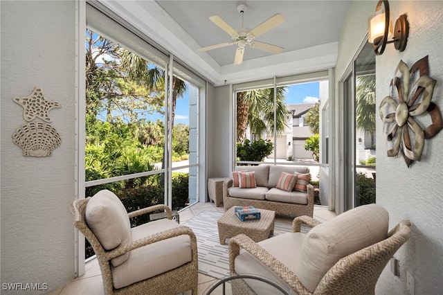 sunroom / solarium featuring ceiling fan