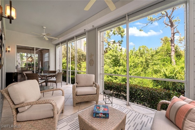 sunroom / solarium featuring ceiling fan