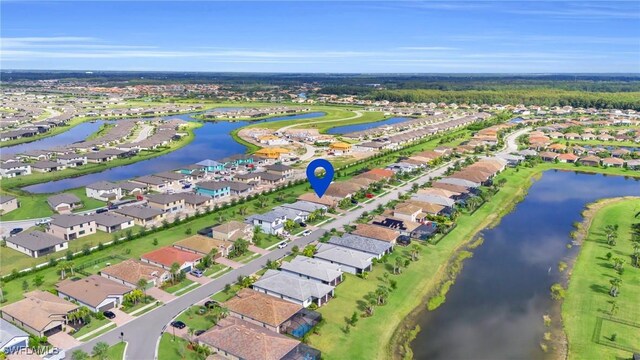 bird's eye view with a residential view and a water view