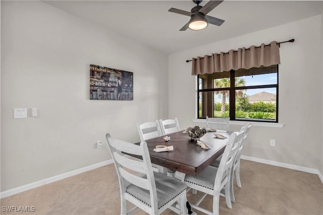 tiled dining area featuring ceiling fan