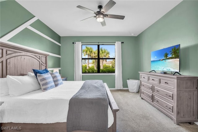 bedroom featuring light carpet and ceiling fan