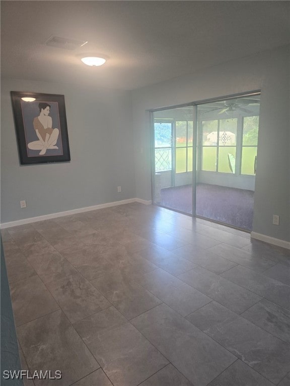 unfurnished room with ceiling fan