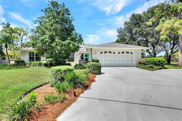 single story home with a front yard and a garage