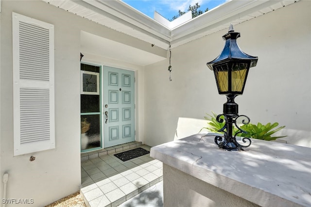 521 Piper Blvd, Naples, FL 34110 - doorway to property with stucco siding