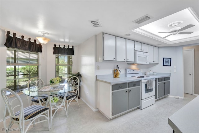 kitchen featuring gray cabinets, white appliances, and ceiling fan