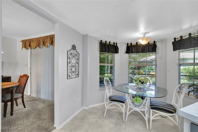 view of carpeted dining area