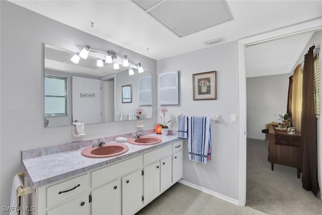 bathroom with tile patterned flooring and vanity