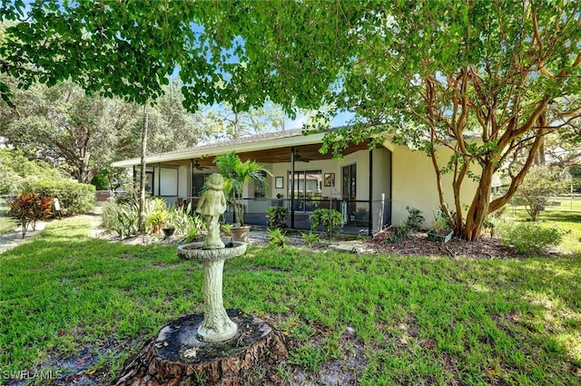 back of property featuring a yard and a porch