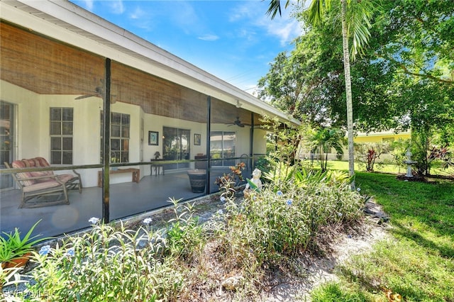 exterior space featuring ceiling fan