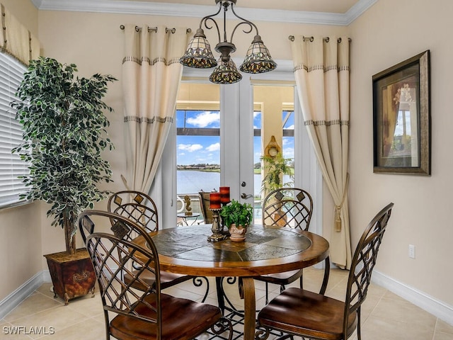 tiled dining area featuring ornamental molding